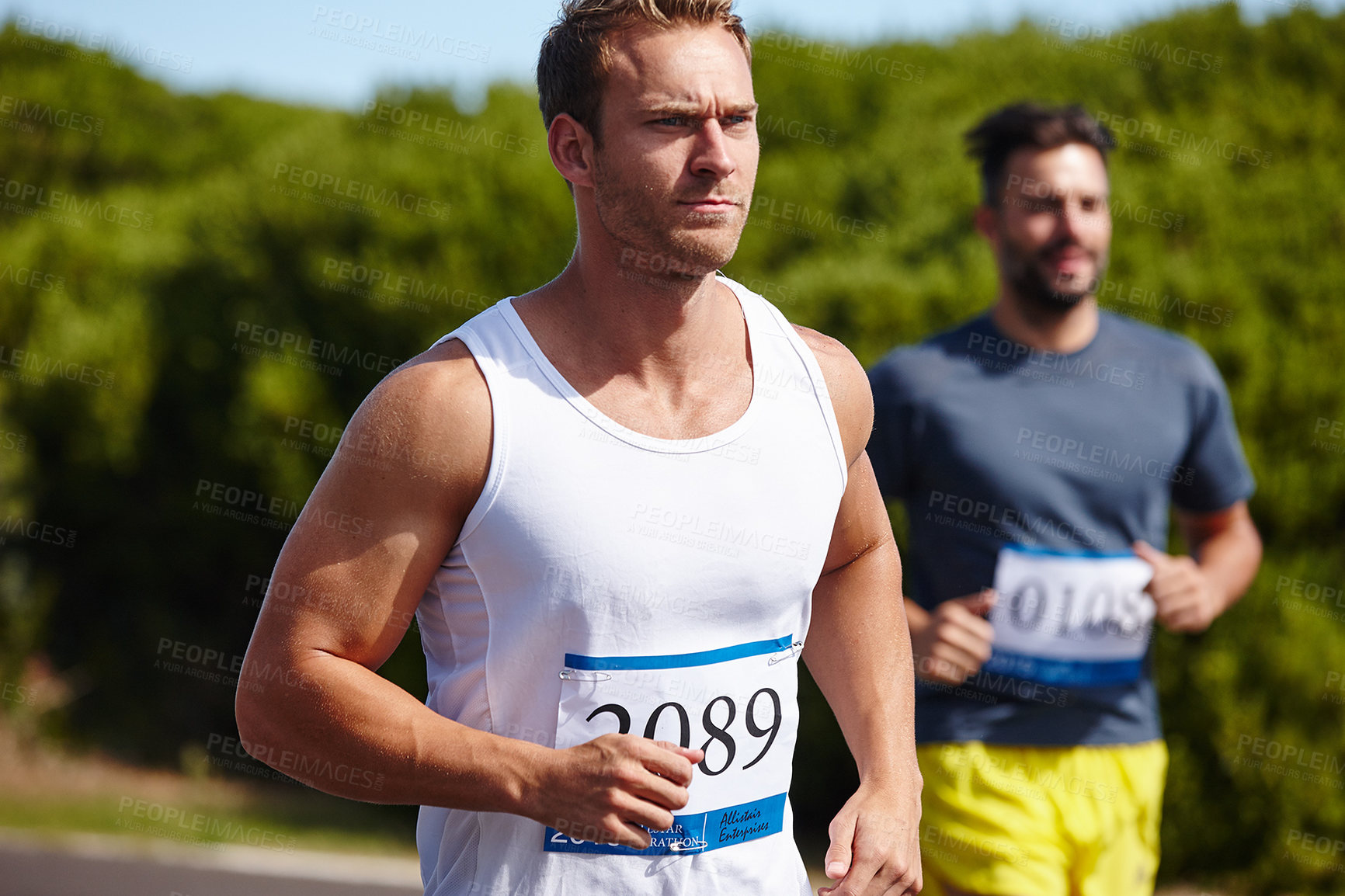 Buy stock photo Competition, man and running marathon in nature for endurance challenge, long distance workout and training. Sports, athlete and people with cardio exercise for fitness race, contest and healthy body