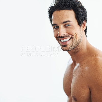 Buy stock photo Shot of a man posing shirtless over a white background
