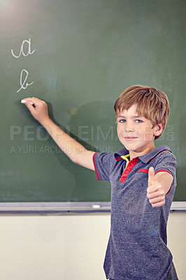 Buy stock photo Portrait, child writing and thumbs up on blackboard in classroom, elementary school and mockup. Chalkboard, education student and kid with hand gesture for like emoji, agreement and learning to write