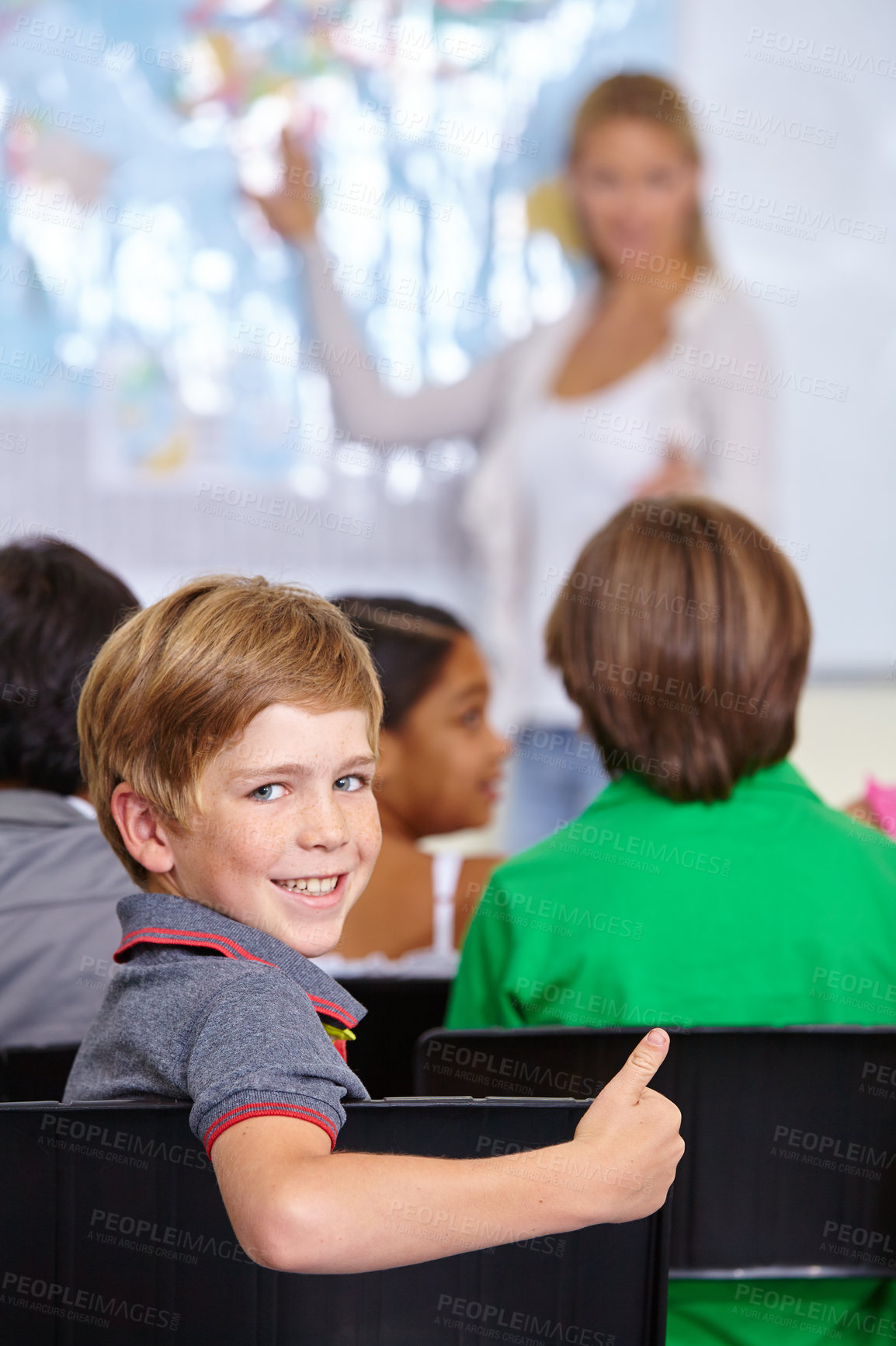 Buy stock photo Child, portrait and thumbs up of student in classroom, elementary school or class. Smile, education and kid with hand gesture for like emoji, agreement or learning, success and approval sign.