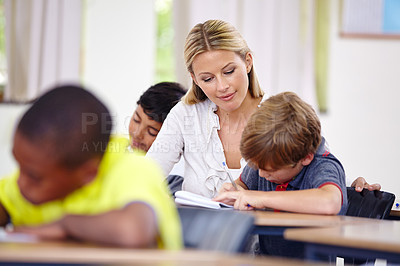 Buy stock photo Teacher, kid or writing in classroom for learning, education and helping for language development or support. Woman teaching, assessment or child student with knowledge or notebook at middle school