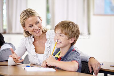 Buy stock photo Teacher, student and helping with school work in classroom, question and think of answer for education and knowledge. Teaching, learn and woman with boy in class, study and problem solving for test