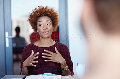 Buy stock photo Shot of two colleagues having a discussion in the office