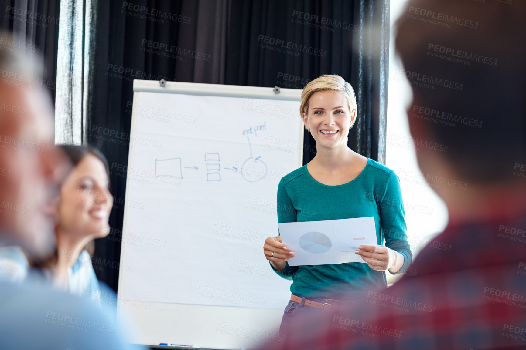 Buy stock photo Shot of an attractive woman doing a presentation for her colleagues