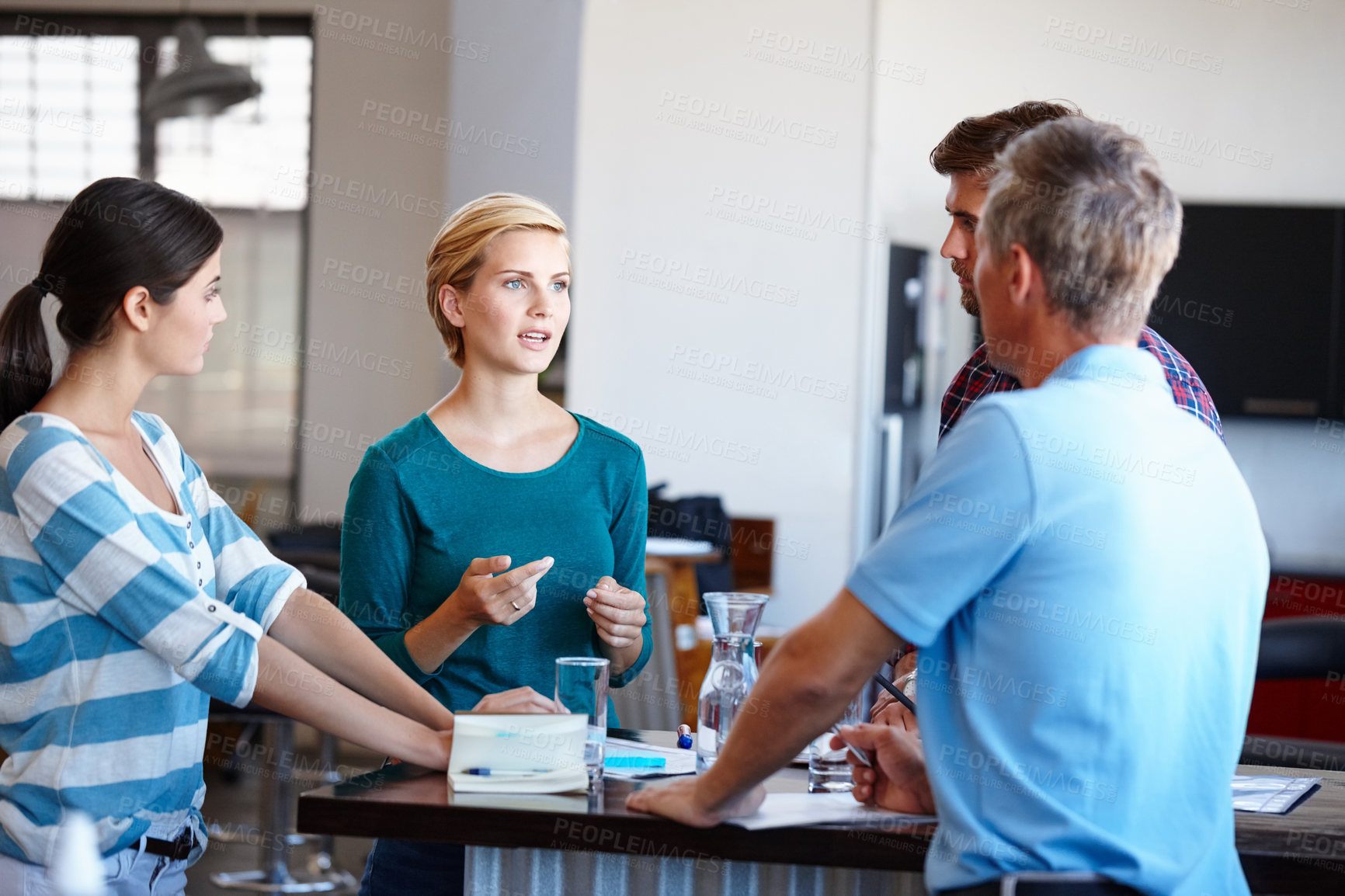 Buy stock photo Shot of a group of colleagues having a brainstorming sesion