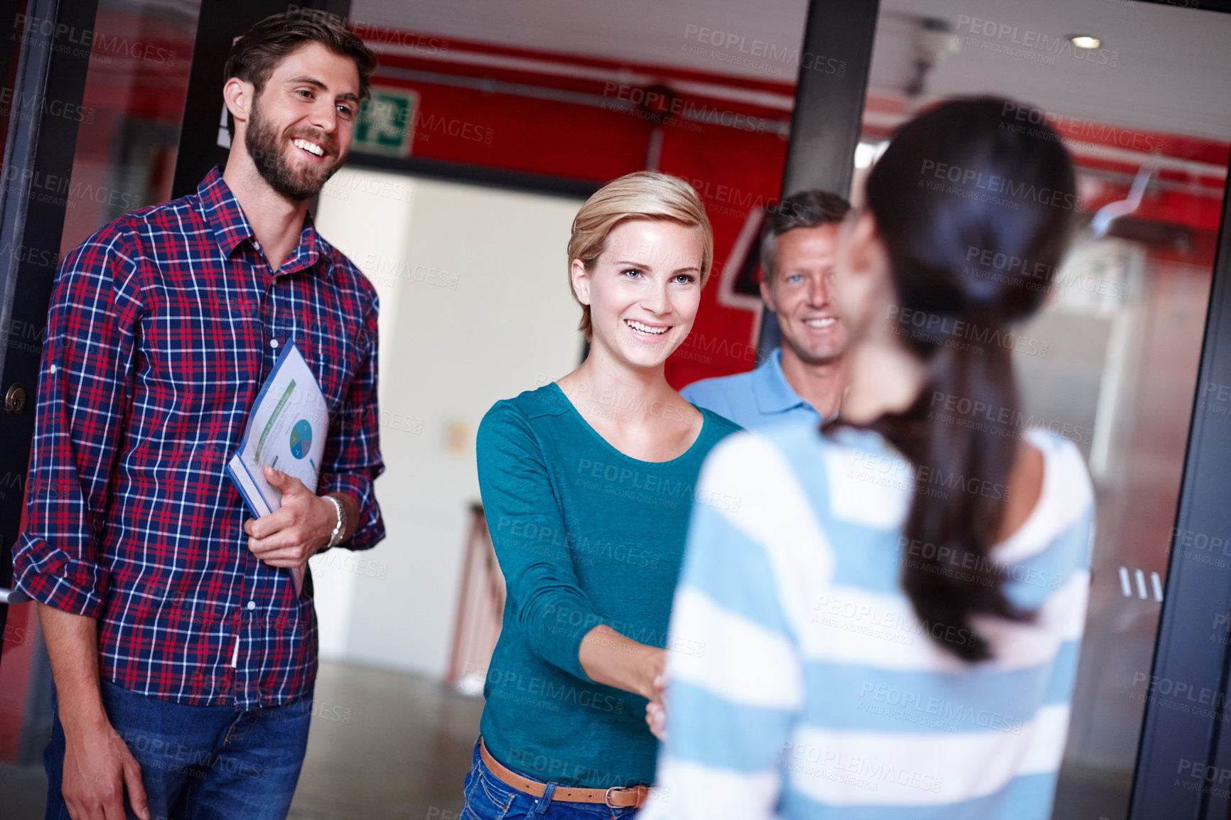 Buy stock photo Shot of coworkers shaking hands in an office