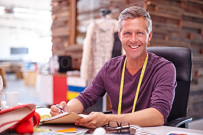 Buy stock photo Cropped shot of a handsome designer at work in his office