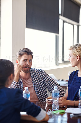 Buy stock photo Cropped shot of creative professionals having a meeting