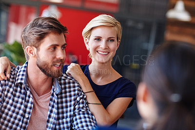 Buy stock photo Cropped shot of coworkers in an informal office setting
