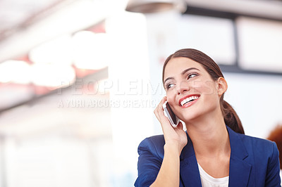 Buy stock photo Cropped shot of an attractive young businesswoman talking on her cellphone