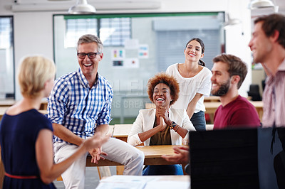 Buy stock photo Cropped shot of a group of designers having an informal office meeting