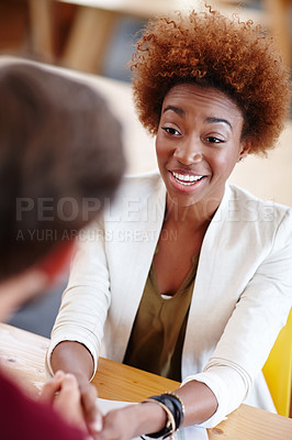 Buy stock photo Cropped shot of two colleagues talking in the office