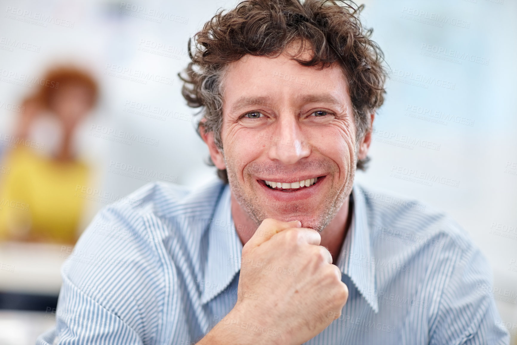 Buy stock photo Cropped portrait of a handsome businessman sitting in the office