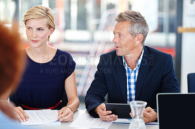 Buy stock photo Cropped shot of a group of designers having an office meeting