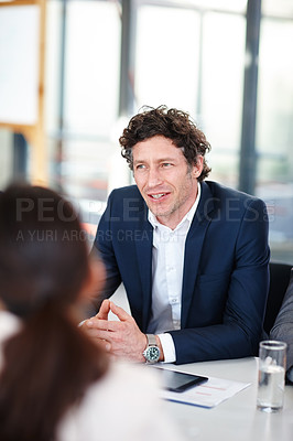 Buy stock photo Cropped shot of a businessman in a meeting with his colleagues