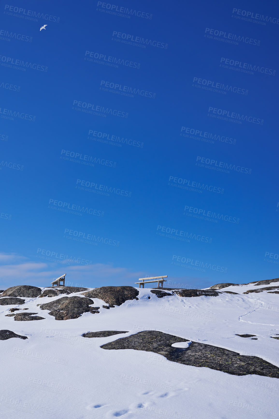 Buy stock photo Landscape, rocks and mountains with snow, sky and bench with mockup space in Ilulissat, Greenland, Denmark. Outdoor, ice and path by hill in winter with horizon, ecosystem and stone in environment