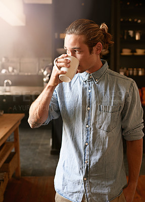 Buy stock photo Man, thinking and drinking coffee in home with espresso, mug and hot drink in the morning in kitchen. Breakfast blend, caffeine break and weekend with green tea, contemplation and memory with style