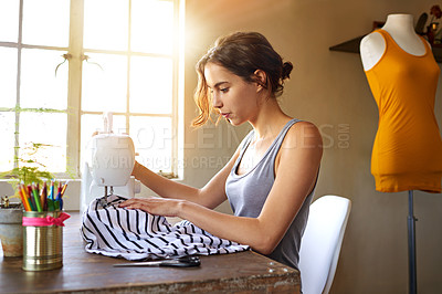 Buy stock photo A young designer making a garment in her workplace