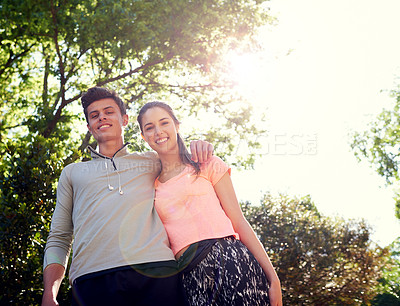 Buy stock photo Portrait of a sporty young couple walking together in nature
