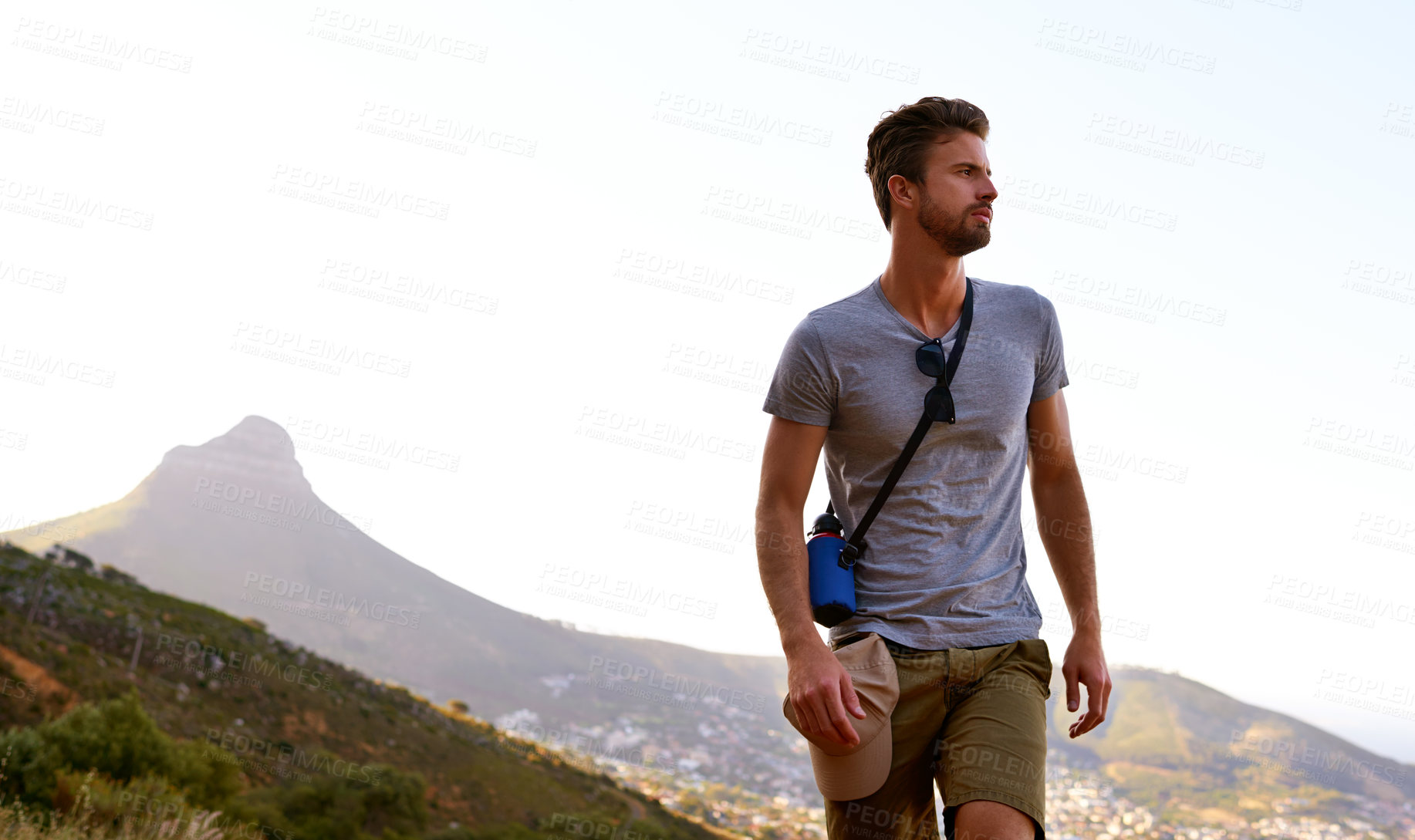 Buy stock photo Hiking, outdoor and man on holiday, travel and adventure in nature, space and tourist on cliff and serious. Mountain, thinking and person on vacation, traveller and wellness in environment and peace