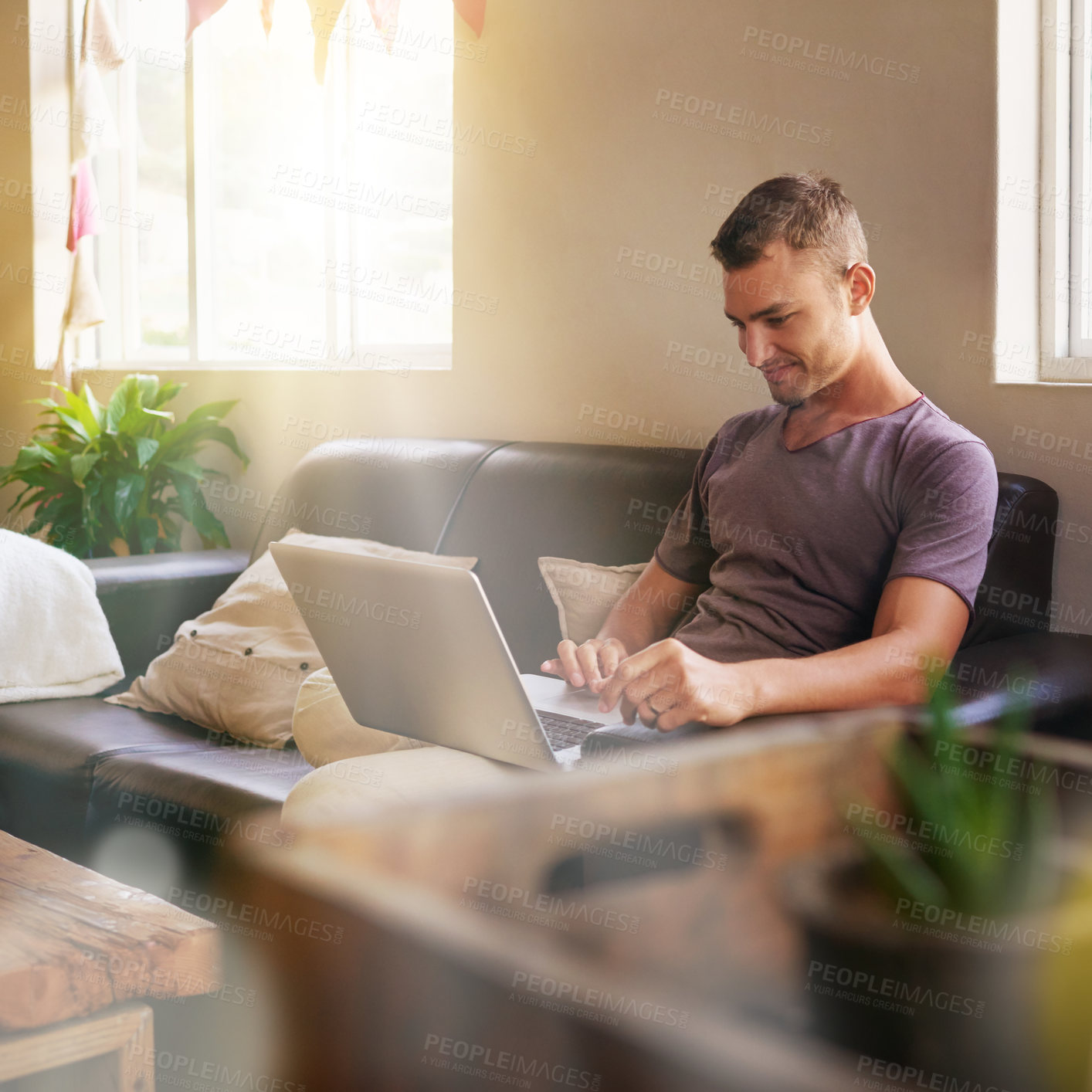 Buy stock photo Couch, man and smile with laptop for freelance, research and self employed with technology at home. Remote work, male person and content writer with digital for typing blog, review article and flare