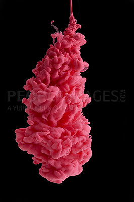 Buy stock photo Studio shot of pink ink in water against a black background