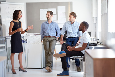 Buy stock photo Shot of a group of designers talking together in a presentation