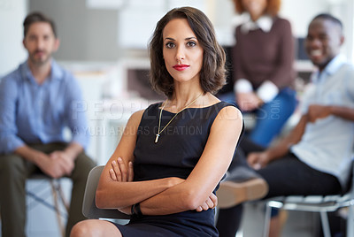 Buy stock photo Portrait of an attractive businesswoman with coworkers in the background