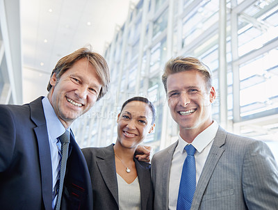 Buy stock photo Business people, portrait and confident in office, embrace and pride in partnership or staff. Happy coworkers, teamwork and collaboration or support in workplace, smiling and hugging for solidarity