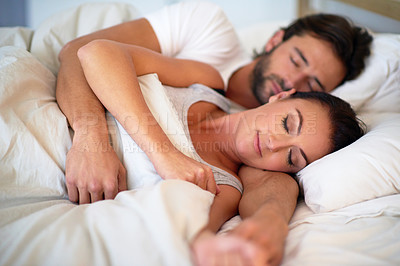 Buy stock photo Couple, dreaming and rest in bedroom of home, peace and man together with woman in bed. Marriage, love and partners hugging for romance with care, relax and pyjamas for sleeping in house and embrace