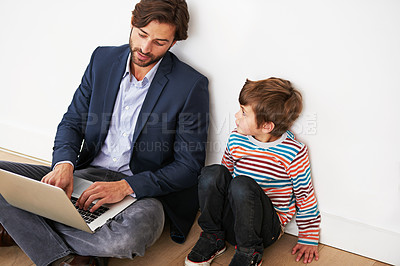 Buy stock photo Father, son and relax on floor with laptop for remote work with video streaming, online games and movies in home. Family, parent and child with technology on ground for bonding, communication and fun