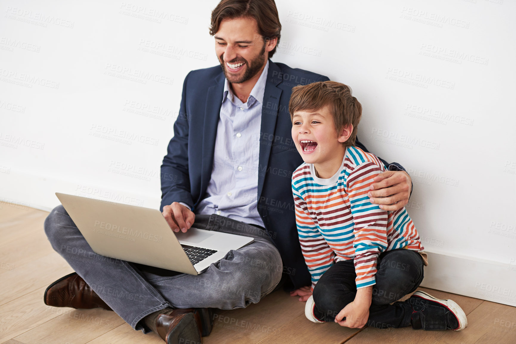 Buy stock photo Father, child and laptop on floor for funny movie, game or parent reading meme with boy at home. Kid, dad and computer for comedy, laughing and family bonding together with technology on internet