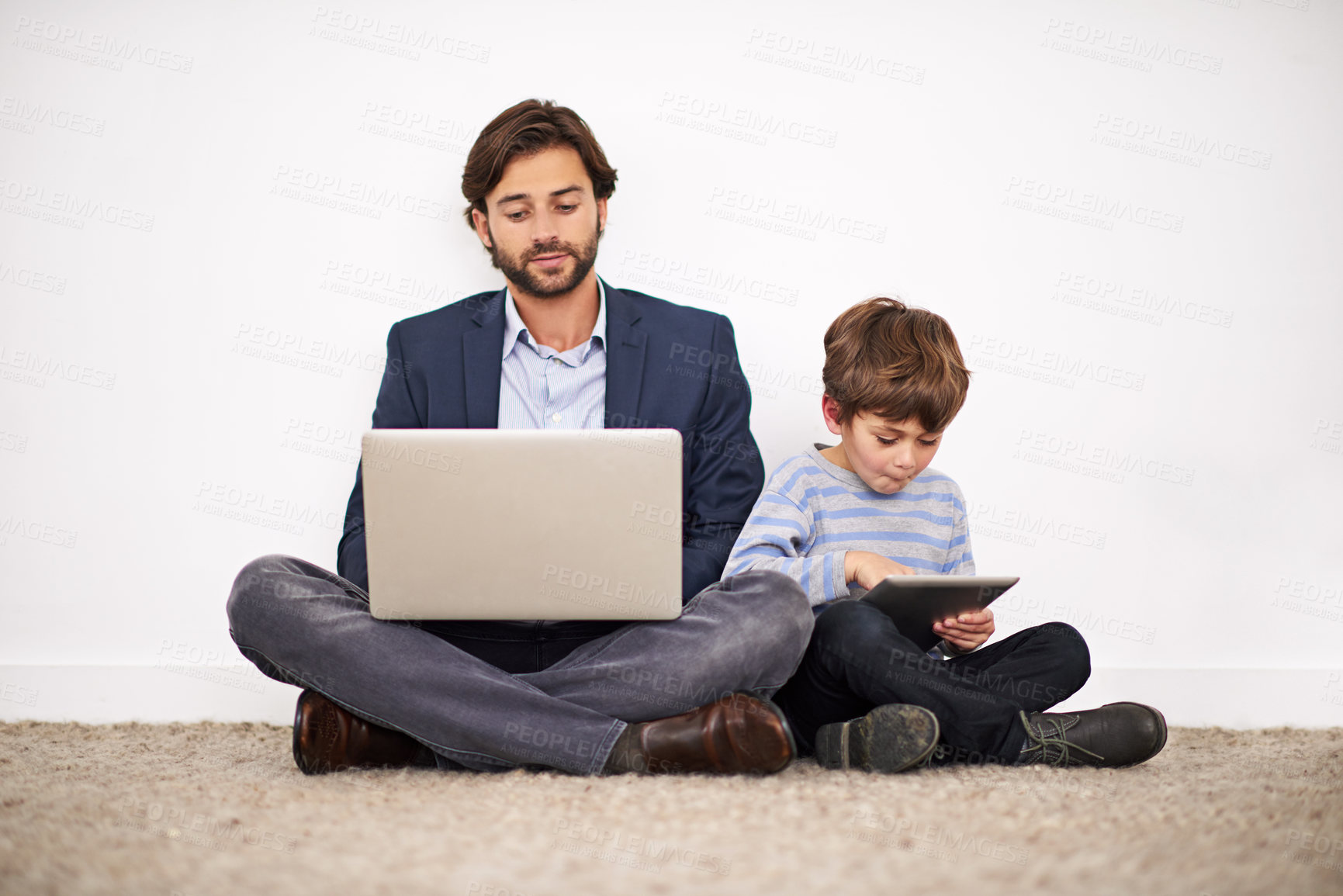 Buy stock photo Father, laptop and kid with tablet on floor for learning, online education and relax at home. Child, dad and computer for internet, studying and family reading info on technology together by wall