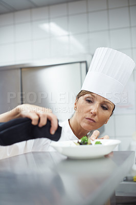 Buy stock photo Chef, woman and plate in kitchen for catering service, fine dining or prepare dish. Hospitality, professional and female person with cloth for cooking meal, food industry or dinner in restaurant