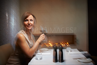 Buy stock photo Cropped shot of an attractive woman waiting for her date in a restaurant