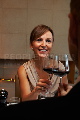 Buy stock photo Cropped shot of a couple having dinner in a restaurant