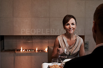 Buy stock photo Cropped shot of a couple having dinner in a restaurant