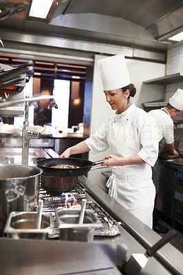 Buy stock photo Chef, woman and frying pan in restaurant kitchen, catering service and prepare food for fine dining. Professional, cooking and female person saute meat for meal, diet and nutrition for hospitality.