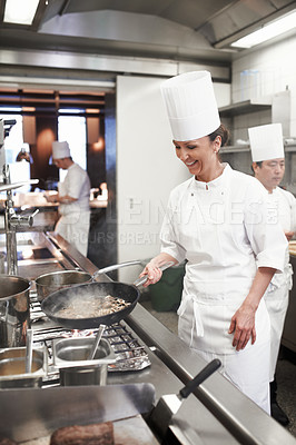 Buy stock photo Chef, woman and frying in restaurant kitchen, catering service and prepare food for fine dining. Professional, cooking and female person saute meat with cook pan making meal nutrition for hospitality