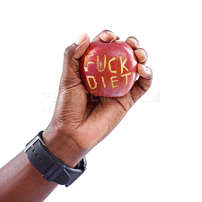 Buy stock photo Shot of a hand holding an anti-dieting apple