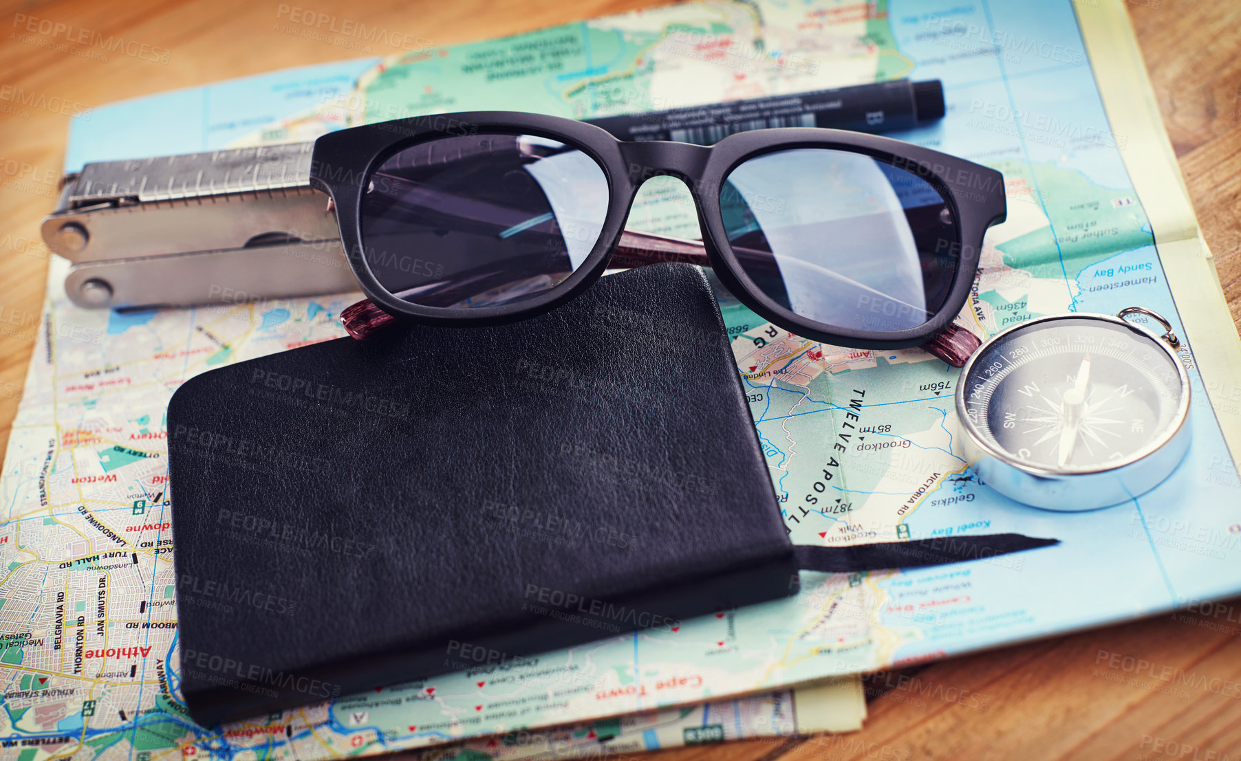 Buy stock photo Sunglasses, map and notebook with compass on table for itinerary schedule, adventure guide and direction. Tools, vacation and location with holiday planning for tourism, navigation and travel explore