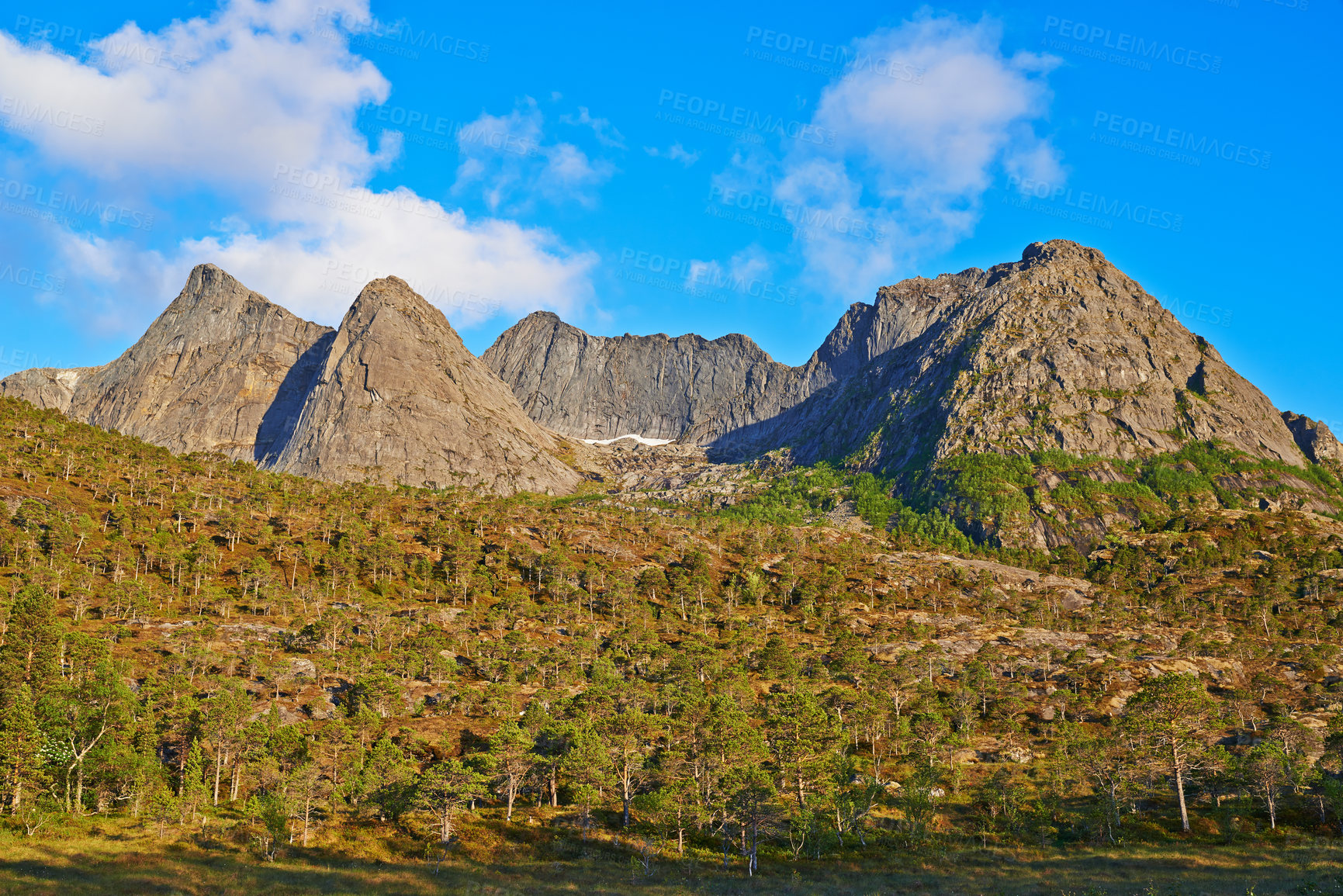 Buy stock photo Landscape of mountains north of the polar and arctic circle in Norway. Scenic view of rolling hills in remote area with clouds in cold winter. Traveling abroad and overseas for holiday and vacation