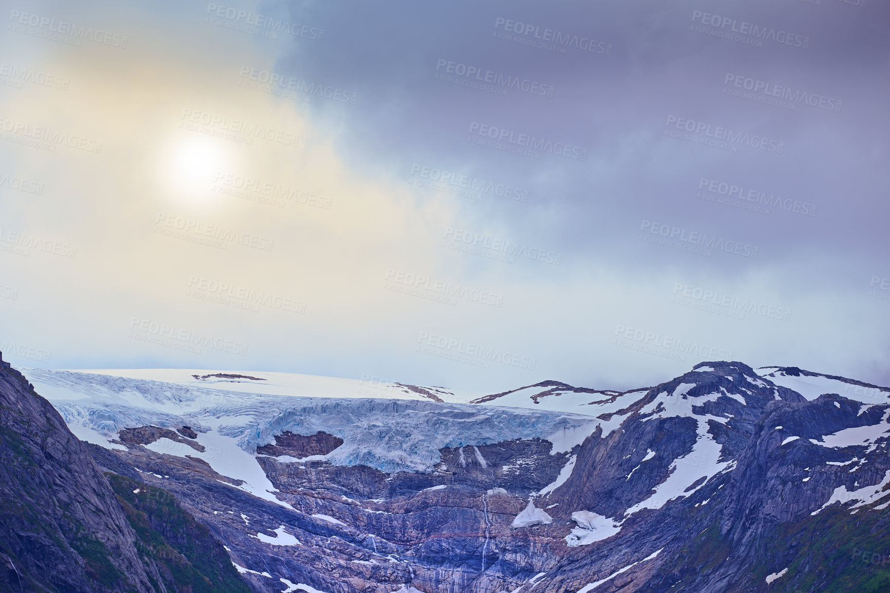 Buy stock photo Mountains, snow and landscape with sunshine for climate change, global warming and ecology. Melting ice on cliff or rocks for environment, weather and winter mockup or glacier background in Norway