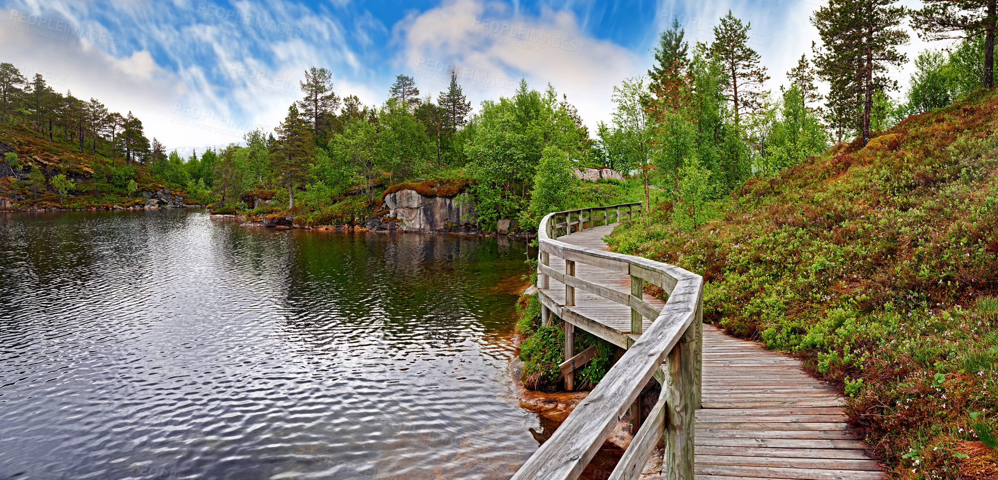 Buy stock photo Landscape, countryside and bridge with lake, water and green trees in Norway for eco friendly. Environment, earth and summer with grass, blue sky and plants for travel, ecology and sustainability