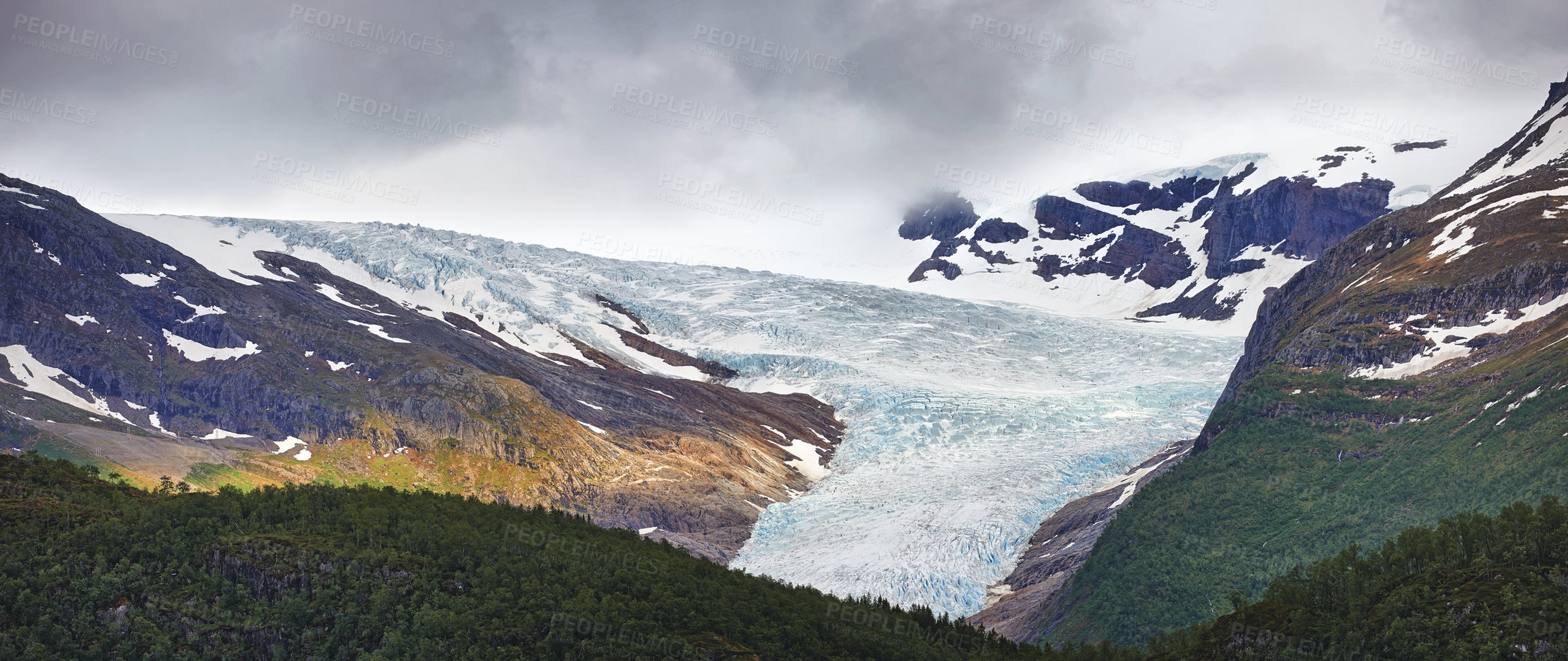 Buy stock photo Glacier, woods and mountain ice with forest in winter for travel, climbing and hiking. Landscape, nature and view of green environment, clouds and Norway countryside for calm adventure on rocks