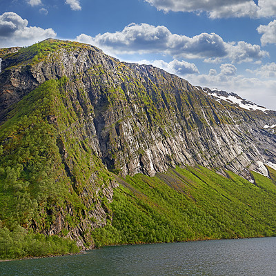 Buy stock photo Landscape of mountains north of the polar and arctic circle in Norway. Scenic view of snowcapped hills in remote area with clouds in cold winter Traveling abroad and overseas for holiday and vacation