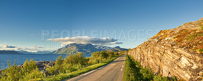 Buy stock photo Mountain wilderness close to Bodo and Kjerringoy in northern Norway. Beautiful nature, hilly scenery. Mediterranean coast curvy asphalt road point of view, blue sky with clouds horizon of a mountain 