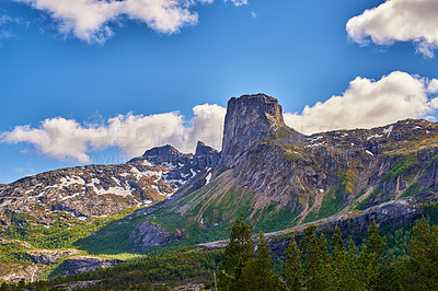 Buy stock photo Mountain, peak and travel with sky in nature destination for remote outdoor holiday or vacation. Earth, forest and trees with clouds in green environment for journey or trip to wilderness location