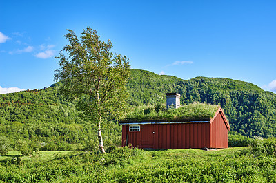 Buy stock photo Cabin, countryside and outdoor travel in hills, Norway and ecology environment for nature. Barn, wallpaper and green location for earth vacation or holiday, rural building and sustainable aesthetic