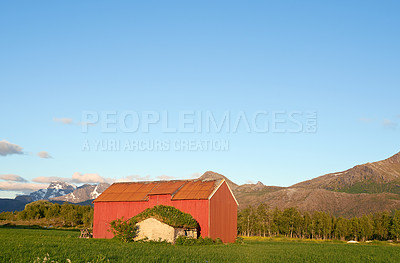 Buy stock photo Barn, countryside and outdoor travel for trip, norway and mountain environment for nature. Blue sky, mockup space and location for earth vacation or holiday, rural building and sustainable aesthetic